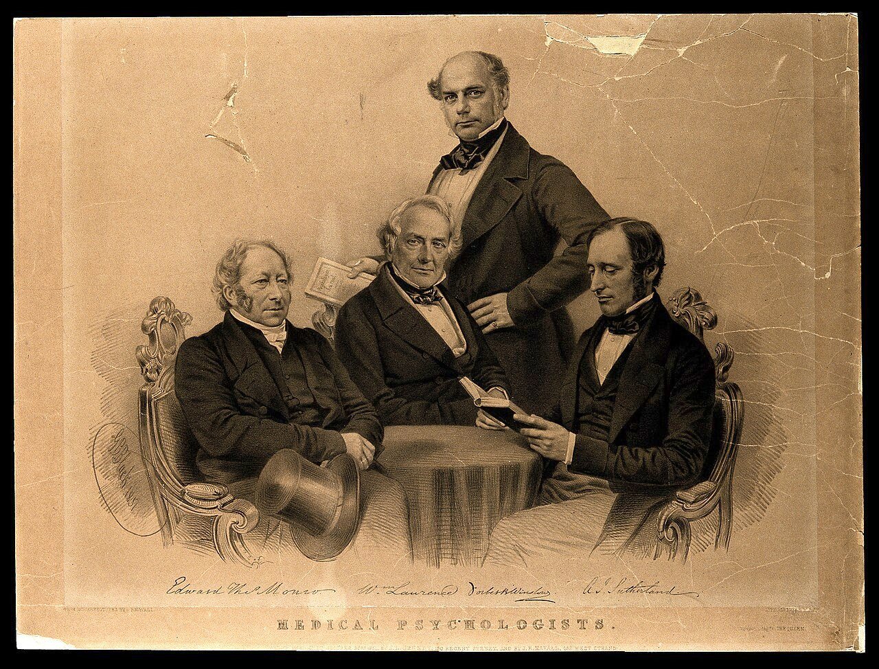 Celebrated psychologists gathered around a table. Lithograp Wellcome V0006740 — Матеріаліст Вільям Лоуренс, суперечка про віталізм і Франкенштейн